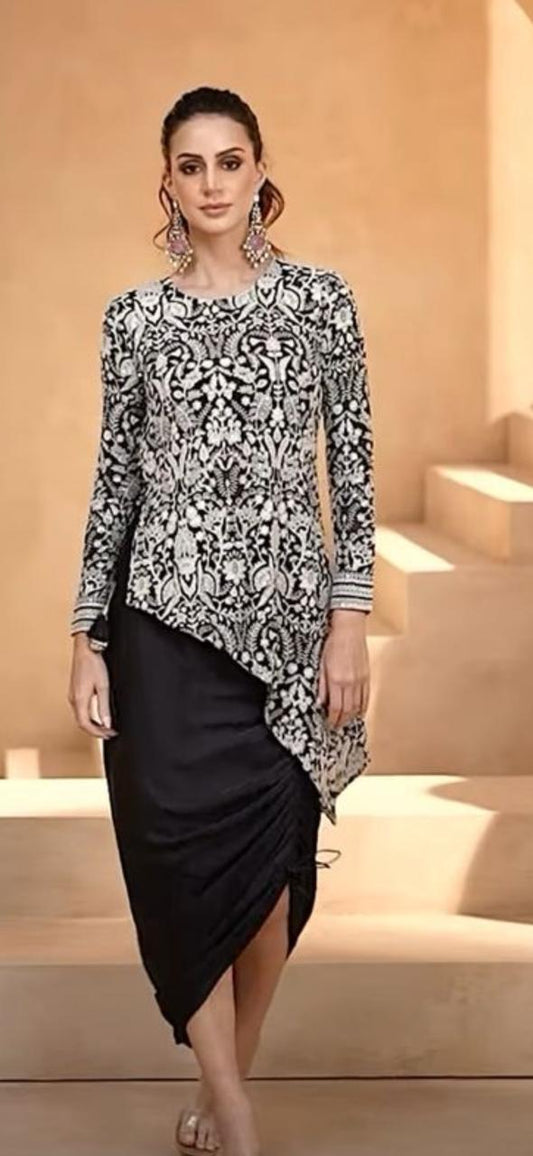 Black and white embroidered top with black pants